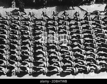 View from above on a formation of the SA troops marching through the Old Town of Nuremberg with the Hitler salute during the Nazi Party Congress in Nuremberg. Stock Photo
