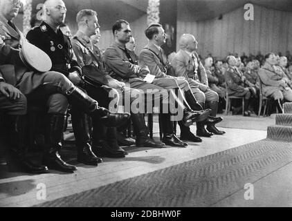 The party congress of the NSDAP is opened in the Luitpoldhalle on the Nazi Party Rally Grounds in Nuremberg. From left: Reich Treasurer Franz Xaver Schwarz, Reich Leader SS Heinrich Himmler, Chief of Staff of the SA Viktor Lutze, Rudolf Hess, Adolf Hitler, Gauleiter Julius Streicher. On the right, Hermann Goering. Stock Photo