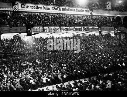 'Banner with the words ''Wir wollen kein Volk minderen Rechtes sein'' (''We don't want to be a nation with inferior rights'') over a banner saying ''Mit Hitler fuer einen Frieden der Ehre und Gleichberechtigung'' (''With Hitler for a peace of honour and equality'') at an election rally of the SA.' Stock Photo