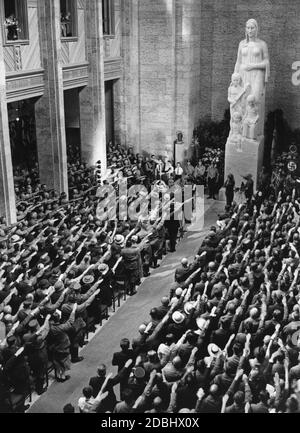 'The ''Haus der Deutschen Erziehung'' (House of German Education) is solemnly inaugurated by Reichswalter Fritz Waechtler of the NSLB, at the national conference of the National Socialist Teachers League in Bayreuth. In honour of the deceased Hans Schemm, the festival assembly sings the song ''Der gute Kamerad'' (The Good Comrade) by Ludwig Uhland. In the middle of the Hall of Honour for the German Mother is the statue of the German Mother.' Stock Photo
