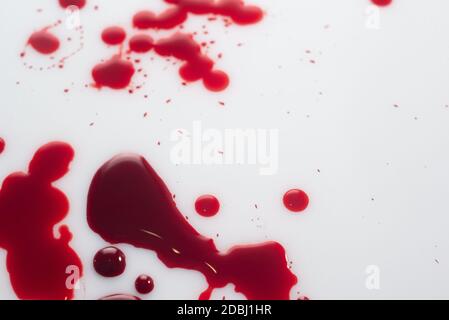 drops of blood, on a white background. view from above drop of blood isolated on white background Stock Photo