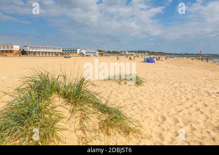 View of beach huts overlooking Sandbanks Beach in Poole Bay, Poole, Dorset, England, United Kingdom, Europe Stock Photo