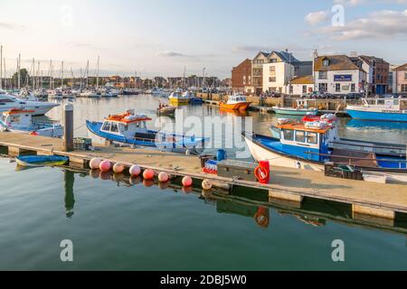 View of harbour boats and quayside houses, Weymouth, Dorset, England, United Kingdom, Europe Stock Photo