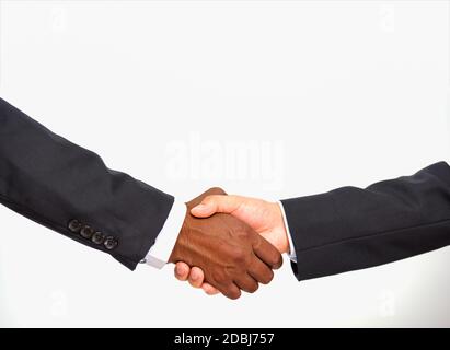 Close up of African businessman black people partnership handshake between together caucasian white people hands, two businessmen great deal, studio s Stock Photo