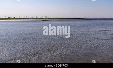 Wind turbines on the Eider in Tönning Stock Photo