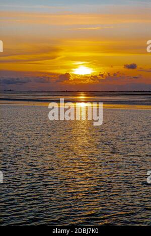 Sunset in the Wadden Sea in front of Pellworm Stock Photo