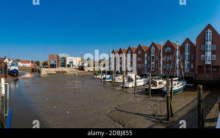 Yachts at low tide in the Husum inland port Stock Photo