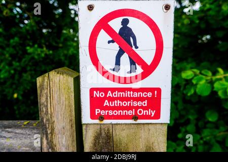 Strictly no admittance to unauthorised persons on wooden gate post Cumbria Stock Photo