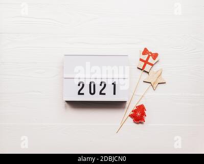 New Year or Christmas layout with numbers 2021. Lightbox with symbols the year Stock Photo