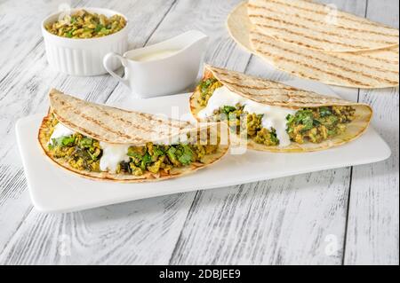 Indian spicy egg and spinach wraps Stock Photo