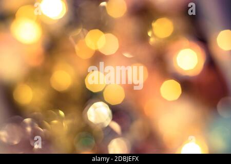 abstract defocused blurred gold background, bright bokeh lights, Christmas and New Year design Stock Photo