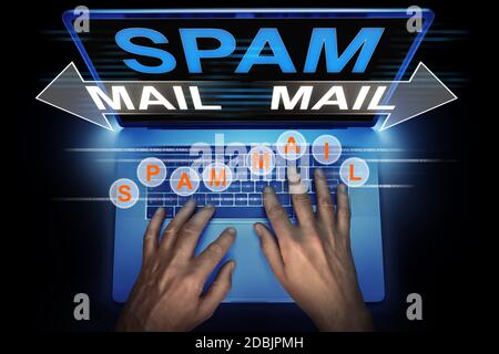 hacker spreads spam mail from his computer Stock Photo