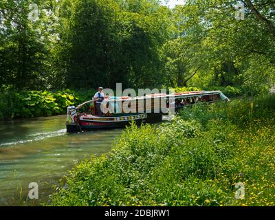 Battery powered narrow boat Birdswood carrying tourists on the Cromford Canal in the Derbyshire Peak District England UK
