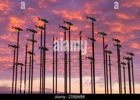 https://l450v.alamy.com/450v/2dbjwb8/fish-on-poles-mobil-swivelling-art-feature-statue-piscatorial-seaside-architecture-of-weather-vanes-on-the-southport-coastal-promenade-merseyside-uk-this-tall-structure-features-metal-fish-cut-outs-on-long-poles-like-a-shoal-of-fish-facing-different-directions-according-to-the-prevailing-winds-2dbjwb8.jpg
