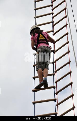 climbing child on a rope ladder Stock Photo