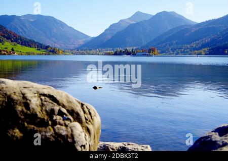 Idyllic mountain lake with an excursion boat framed by high mountains Stock Photo