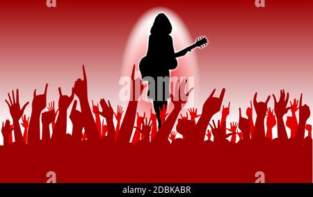 Hands raised in the air at a concert of a female performer Stock Photo