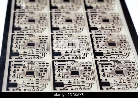 Defocused view of Printed Circuit Board fabrication. Designing diy electronic equipment. Selective soft focus with a shallow depth of field. Modern Te Stock Photo