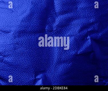 dark blue texture of crumpled sheet of foil, full frame, element for designer Stock Photo