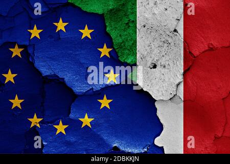 flags of EU and Italy painted on cracked wall Stock Photo