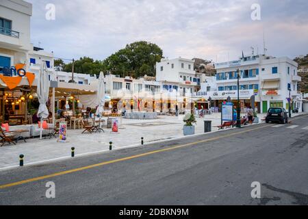 Ios, Greece - September 19, 2020: Street with restaurant and shops in the port of Ios island. Cyclades, Greece Stock Photo