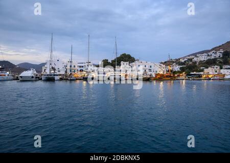Ios, Greece - September 19, 2020: View of bay and port of Ios in the evening. Cyclades Islands, Greece Stock Photo