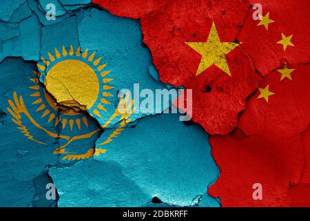 flags of Kazakhstan and China painted on cracked wall Stock Photo