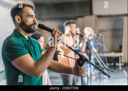 Rehearsal at theatre. Actors preparing for a role during the rehearsal of the play on the new performance for public. Behind the scene Stock Photo