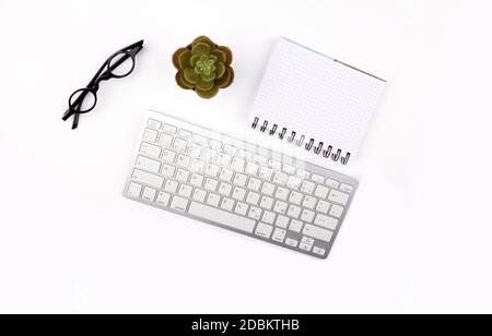 Concept Home Office with office work Tools and plant on white Background Stock Photo