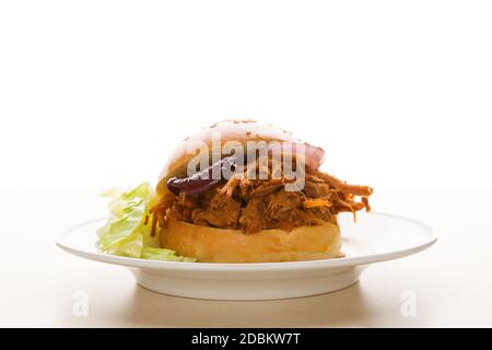 Pulled pork burger on plate. Stock Photo