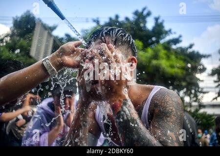 Thailand. 17th Nov, 2020. Pro-democracy protesters clean face with water after police fire tear gas during a demonstration against a charter amendment at Parliament in Bangkok. (Photo by Vichan Poti/Pacific Press) Credit: Pacific Press Media Production Corp./Alamy Live News Stock Photo