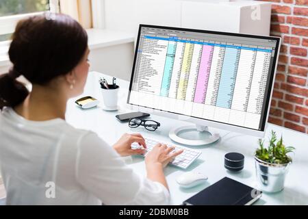 Working With Spreadsheet. Analyzing Data On Laptop Screen Stock Photo