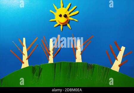 Landscape decoration made by a child from pieces of paper. Stock Photo