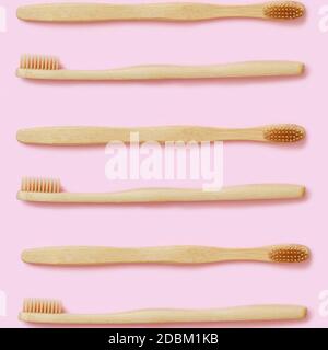 Top view of organic zero waste bamboo toothbrushes on pink background Stock Photo