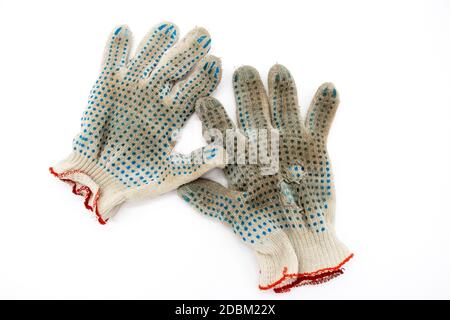 Worn, torn gloves on a white background Stock Photo