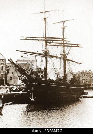 An early 1900's photograph of the sailing ship MARGARET NIXON at Dock End, Whitby, Yorkshire.UK -- Owned in Whitby by Matthew Peacock and John Wallis after registration in the town in March 1876.  Originally built on the Tyne in 1861.  She was considered a 'smart ship' .The 188 ton Brig was commanded by William Fletcher for nearly 30 years and originally had a gilt streak around her hull. Stock Photo