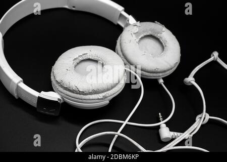 Black headphones lying isolated on white background Stock Photo