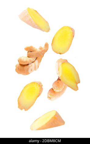 Falling ginger root isolated on white background Stock Photo - Alamy