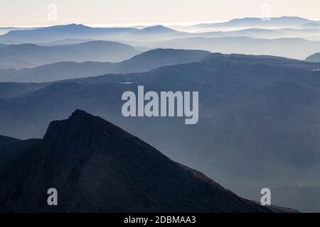 Snowdonia mountains in haze from the summit of Snowdon, North Wales Stock Photo