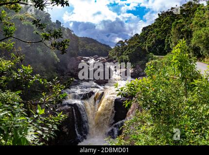 The boiling river with a waterfall in the rainforest Stock Photo