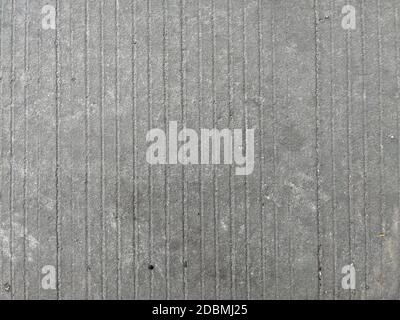 Old striped and cracked concrete floor texture background Stock