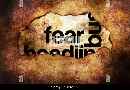 Fear text on paper hole grunge concept Stock Photo