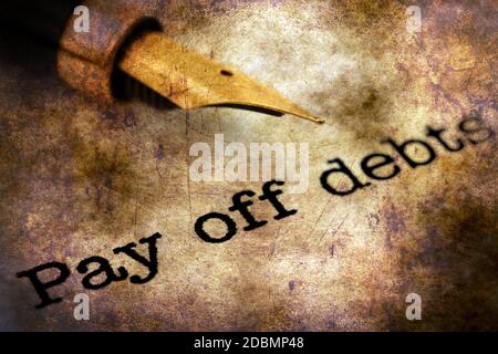 FOuntain pen on pay off debts text Stock Photo