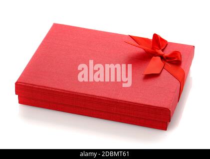 Elegant red gift box with a small bow. Isolated. Gift box for costume jewelry. Stock Photo