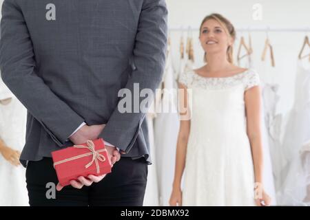Happy bride and groom in wedding dress prepare for married in wedding ceremony. Romantic love of man and woman couple. Stock Photo