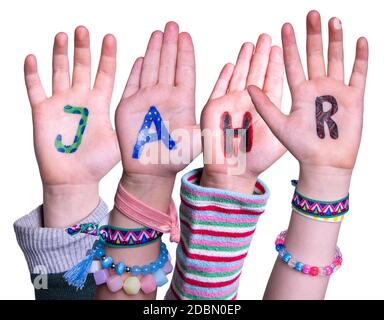 Children Hands Building Colorful German Word Jahr Means Year. White Isolated Background Stock Photo