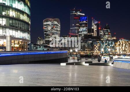 The City of London at night seen from More London Riverside, London England United Kingdom UK Stock Photo