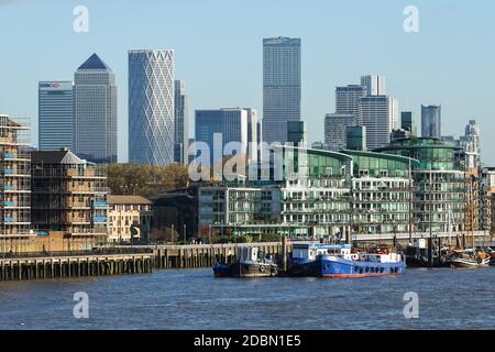 Canary Wharf skyscrapers seen behind residential buildings in London, England, United Kingdom, UK