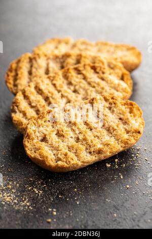 Rusk bread. Dried crispbread on kitchen table. Stock Photo