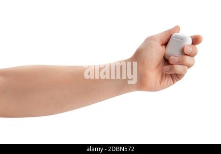 air pods charging case in hand path isolated on white Stock Photo